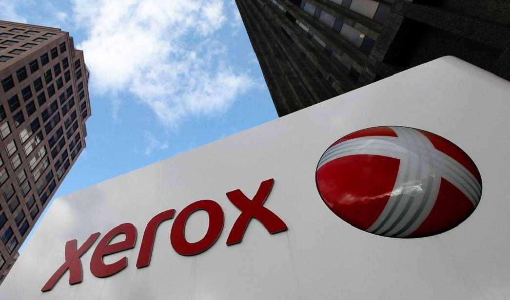 Fujifilm получит Xerox, но потеряет несколько тысяч сотрудников 3 Вывеска Xerox и логотип на фоне городских зданий