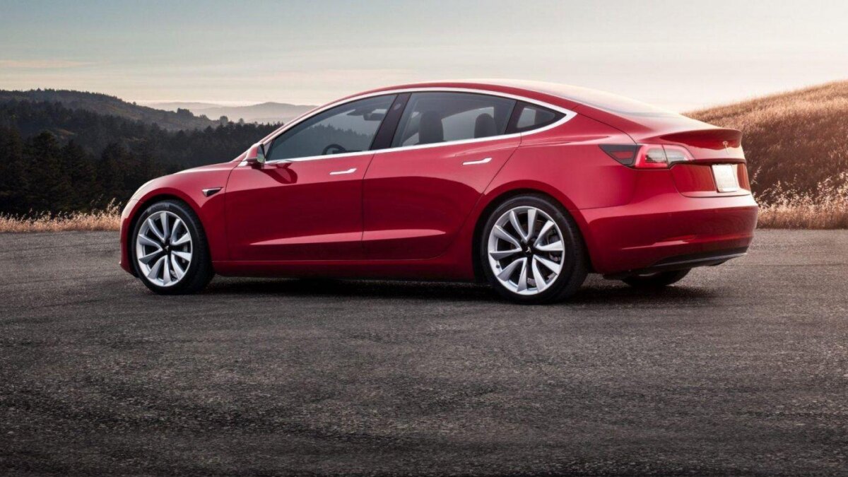red tesla model 3 sunset e1549437553845