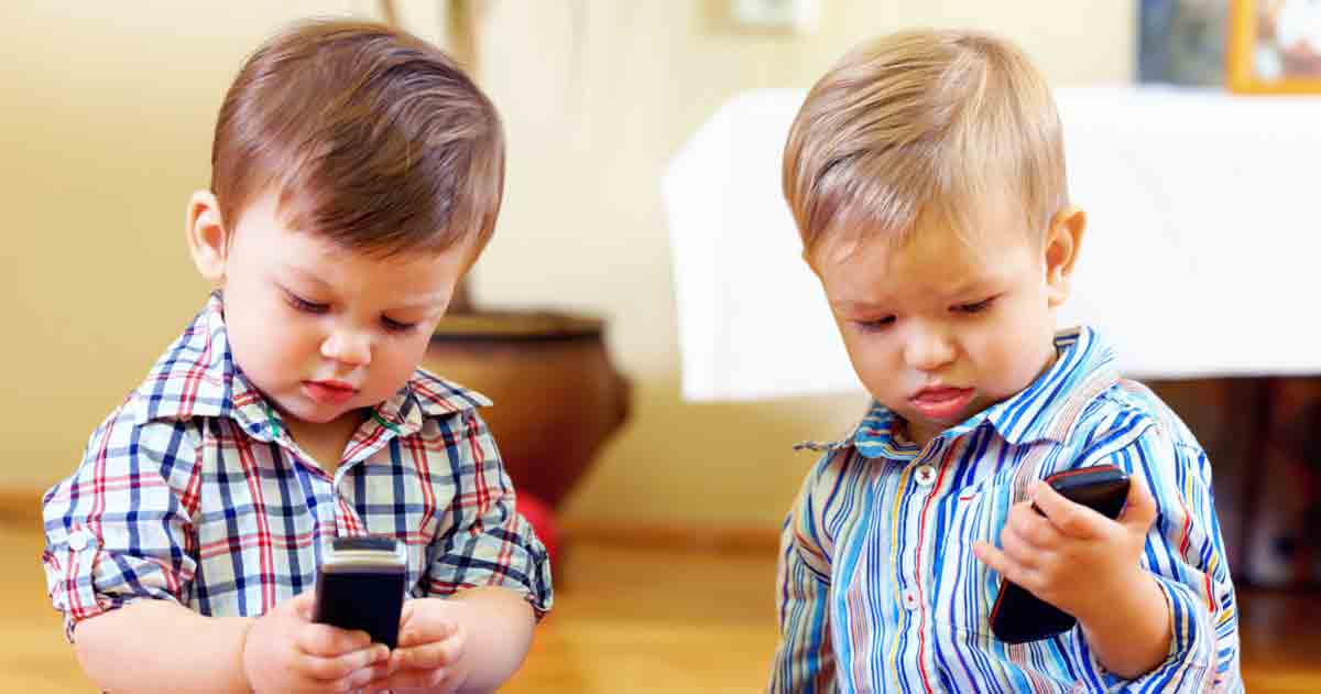 two toddlers cellphone fb