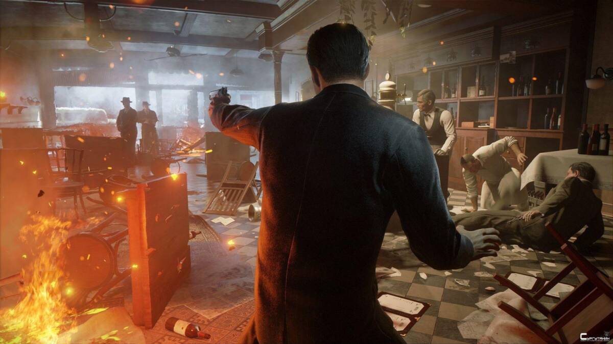 Экшен сцена из ремейка игры Mafia на ПК с огнем и разбросанными предметами