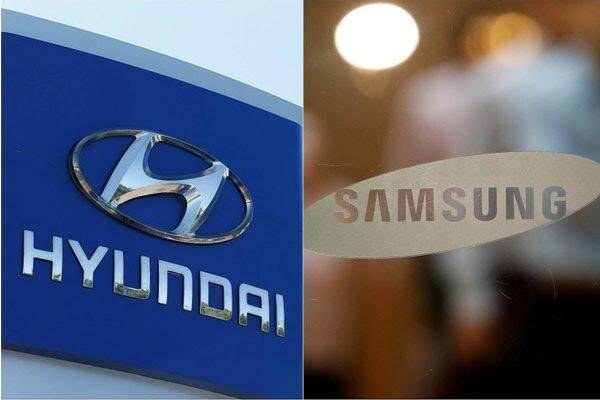 Samsung планирует разрабатывать электромобили совместно с Hyundai 4 Логотип Hyundai и Samsung на фоне офисов и вывесок