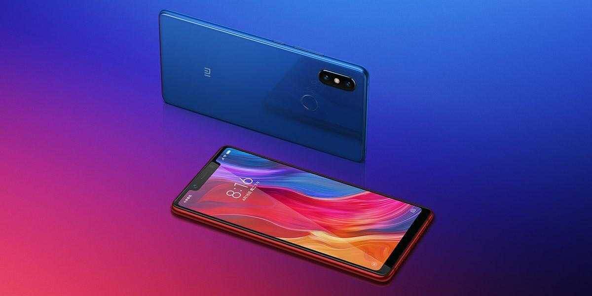 Смартфон Xiaomi Mi 8 SE и Redmi 9 на фоне градиента