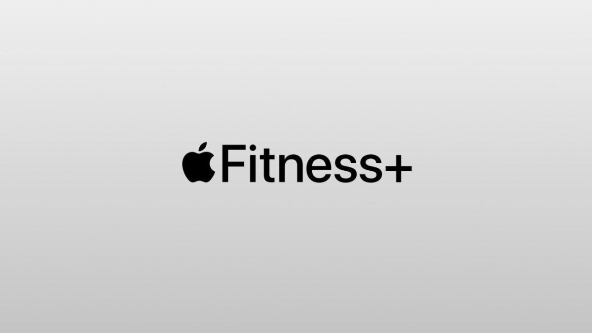 Логотип Apple Fitness+ на сером фоне в центре