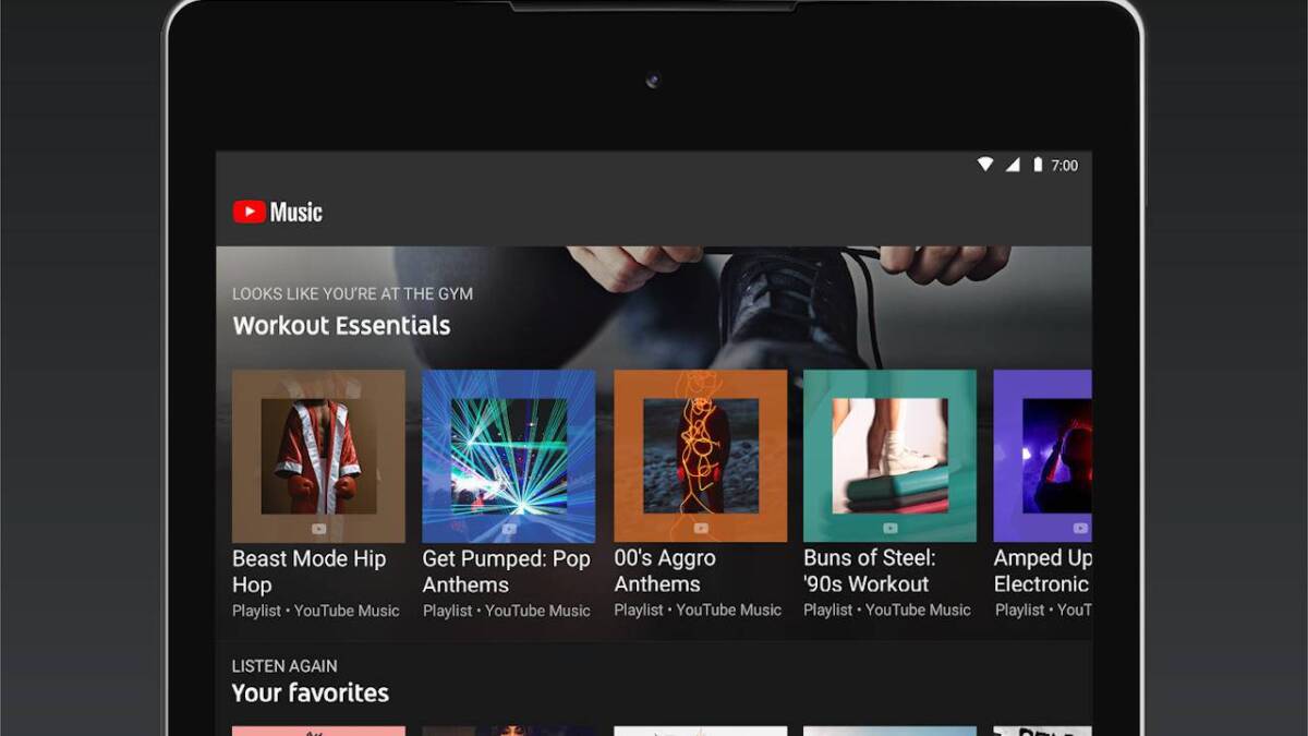 Экран планшета с интерфейсом YouTube Music на фоне черной рамки