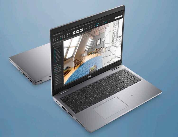 ноутбук Dell с открытым экраном и интерфейсом дизайна