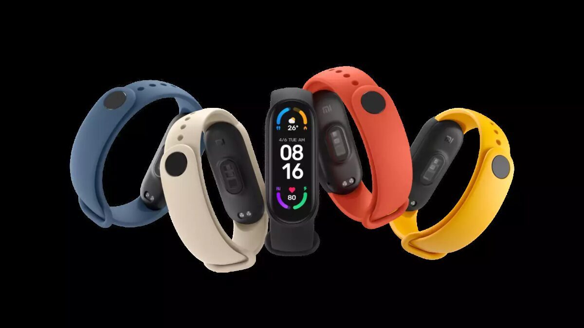Цветные версии фитнес-браслета Xiaomi Mi Band 6 с дисплеем и сенсорами на черном фоне