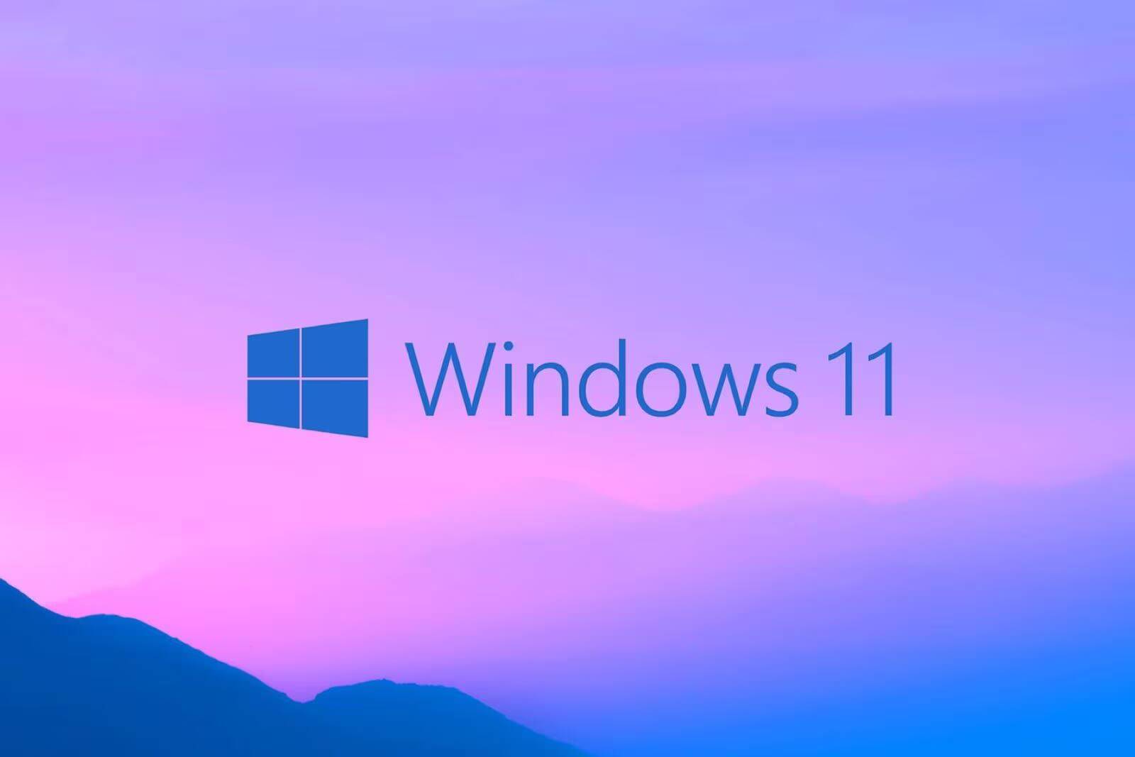 Обложка с логотипом Windows 11 на фоне гор под пурпурным небом