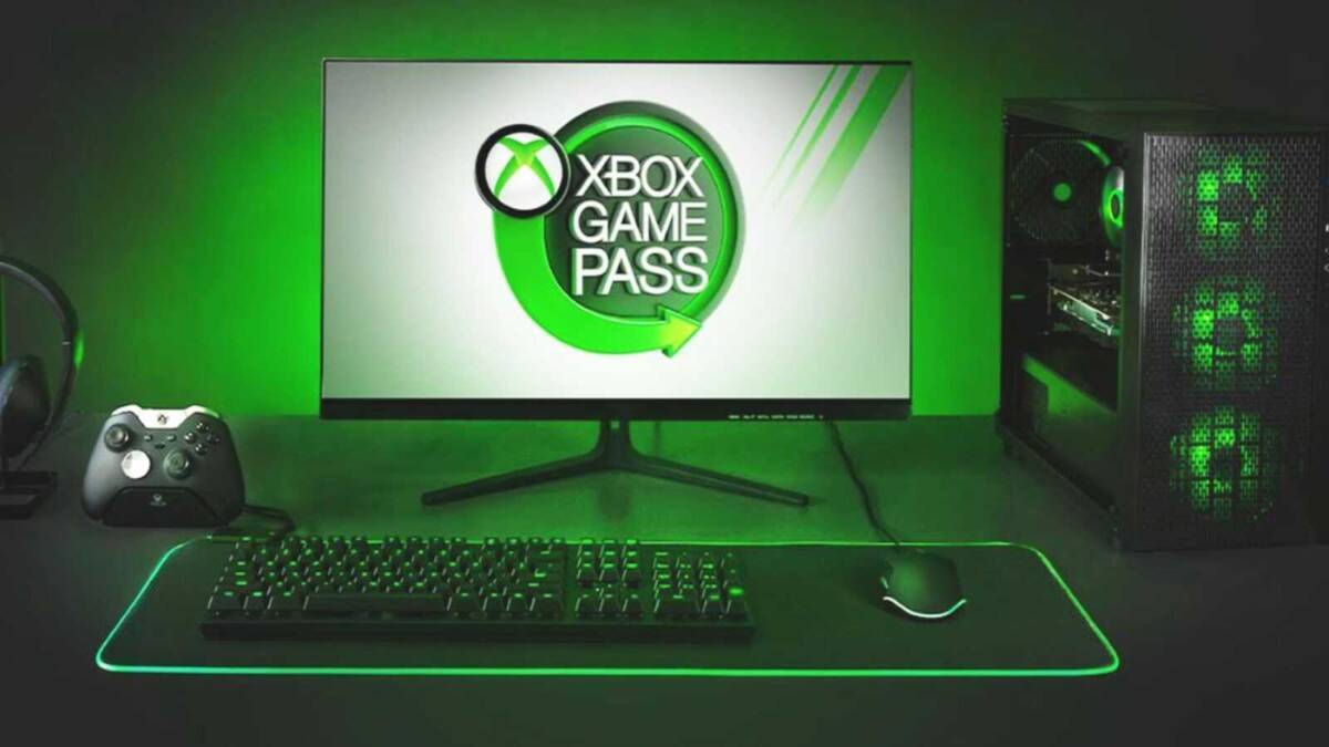 Игровой ПК с зеленой подсветкой, клавиатурой и геймпадом Xbox Game Pass и монитором с логотипом