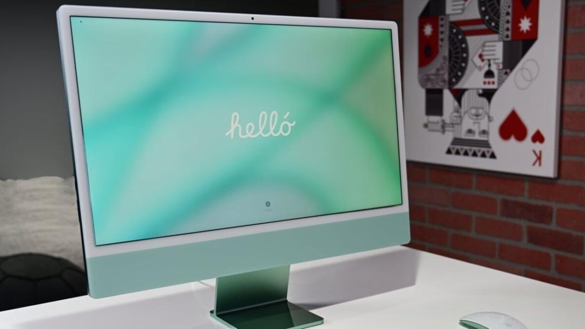 Дисплей 24-дюймового iMac с надписью hello и зеленым градиентным фоном