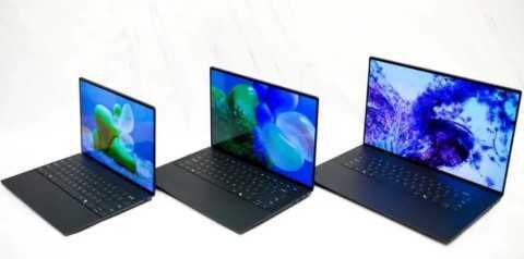 Три ноутбука Dell XPS 2024 в раздвинутом виде с яркими экранами и клавиатурами