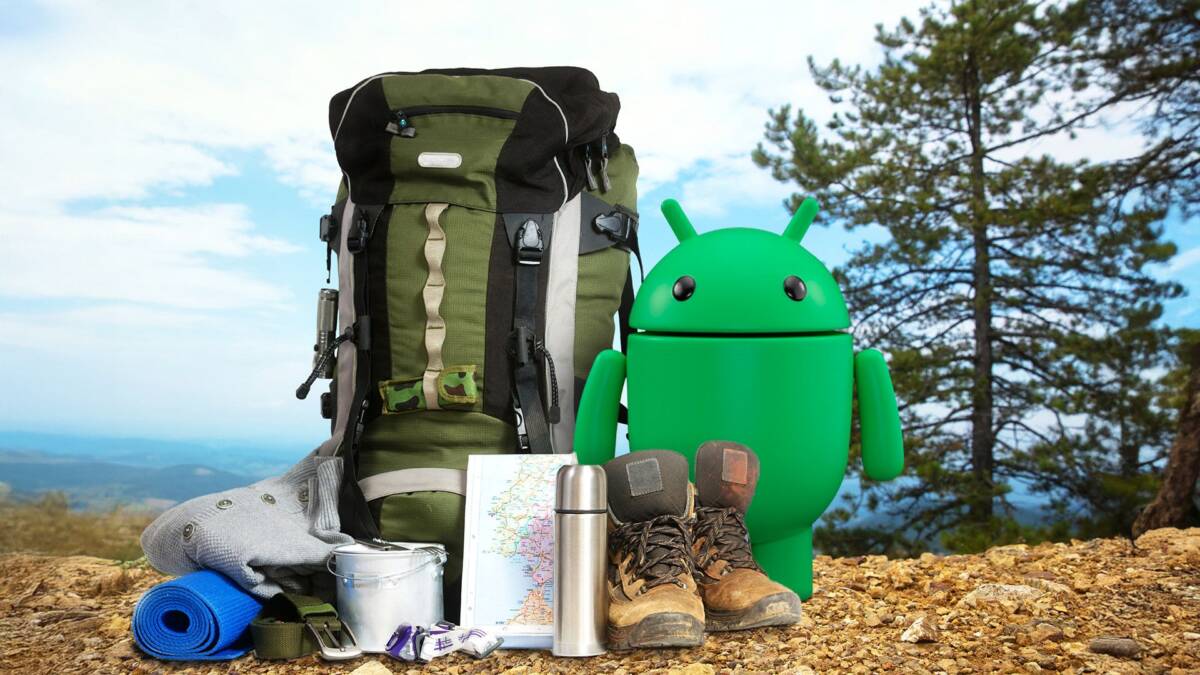 android mascot next to a hiking backpack with some adventure gear around