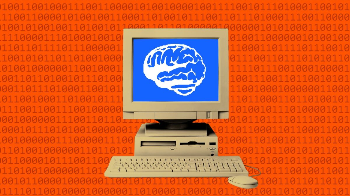старый компьютер с монитором и клавиатурой с изображением мозга