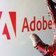 Логотип Adobe на стене офисного помещения в Нойде