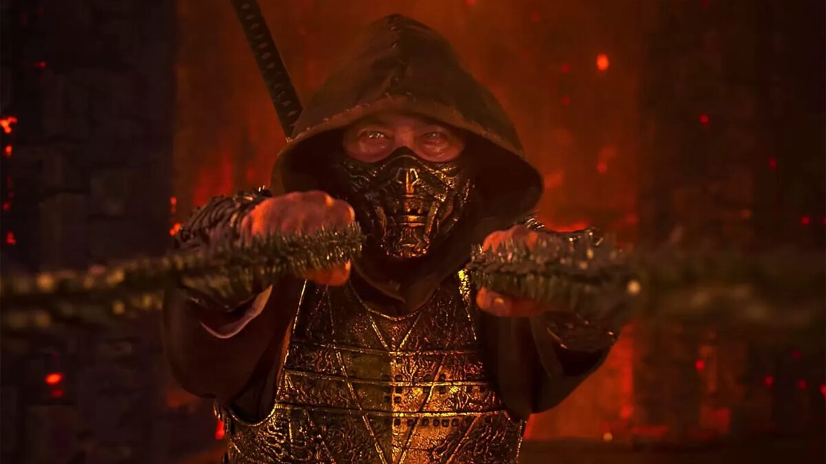 Персонаж из фильма Mortal Kombat 2 в черной маске и броне в огненном фоне