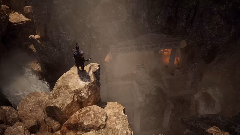 Каменные скалы и человек у водопада в пещере Titan Quest 2