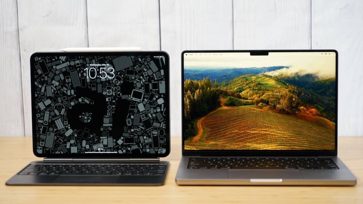 Два ноутбука iPad Pro и MacBook Pro с клавиатурами