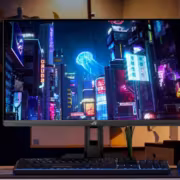компьютерный монитор ASUS ROG Strix XG259QNSR Ace на столе с клавиатурой и мышью