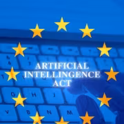 ЕС заставит маркировать реалистичный AI-контент с 2 августа 1 Флаг Европейского союза и клавиатура с надписью Artificial Intelligence Act