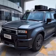 Черный Land Cruiser Prado 250 в стиле Гелендвагена с боксом на крыше и защитой передка