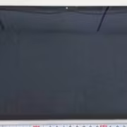 Планшет Samsung Galaxy Tab S12+ лежит на столе с рулеткой сбоку