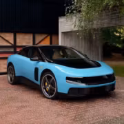 Электромобиль Ferrari Luce голубого цвета на парковке