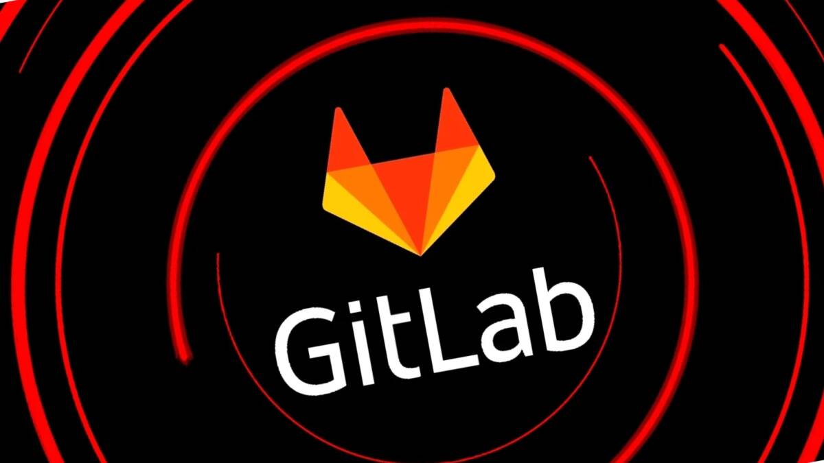 Логотип GitLab на темном экране с красными концентрическими кругами