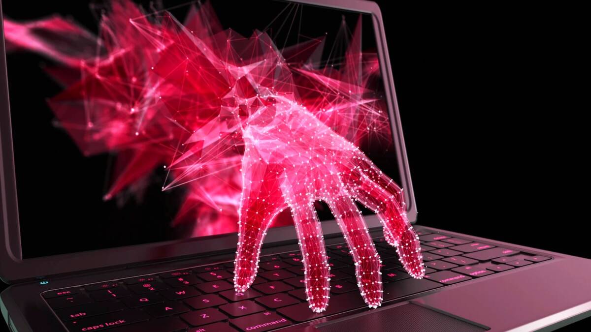Цифровая рука выходит из экрана с ноутбука в виде сетки с pinkлучами