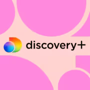 Логотип Discovery Plus на фоне розовых кругов