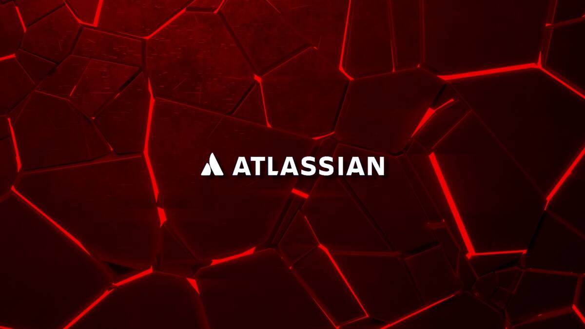 Фон с красными гексагональными панелями. Логотип Atlassian посередине