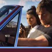 На PS5 с прошивкой 14.10 показали доступ к скрытому меню перед выходом GTA 6 2 Два человека в автомобиле на улице с видами на воду и деревьями с PS5